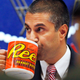 Federal Communications Commission (FCC) Chairman Ajit Pai takes a drink from a mug during an FCC meeting where the FCC will vote on net neutrality, Thursday, Dec. 14, 2017, in Washington.